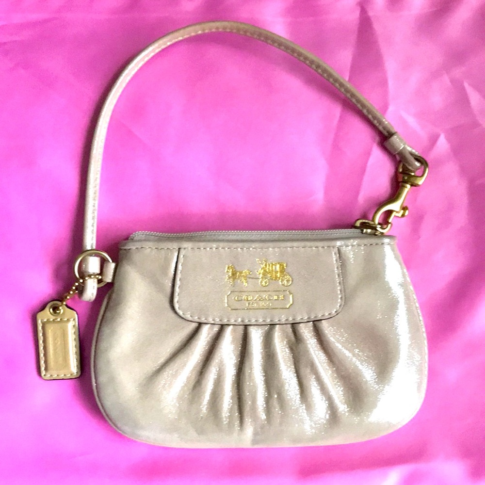 Fabulous Coach signature shiny silky cream wristlet with zipper closure. Clean!!